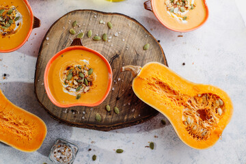 Traditional autumn butternut squash soup with seeds.
