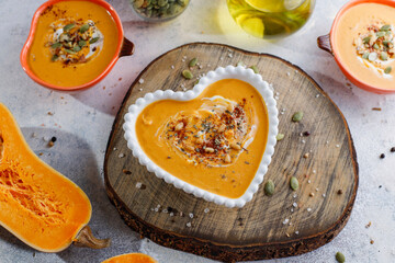 Traditional autumn butternut squash soup with seeds.