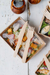 Healthy salads in plastic package for take away or food delivery.
