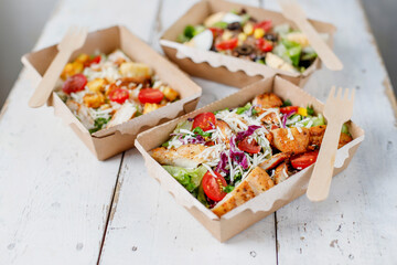 Healthy salads in plastic package for take away or food delivery.