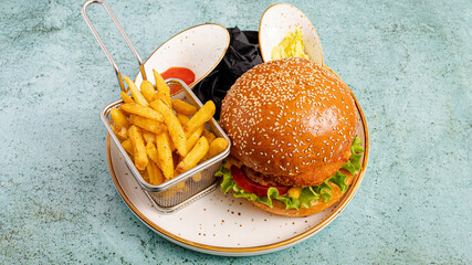 Burger and French fries  with ketchup and mayonnaise