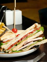Club sandwich with French fries