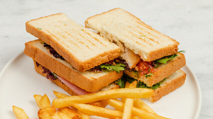 Club sandwich with French fries