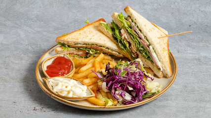 Club sandwich with French fries