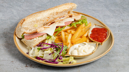 Delicious Italian sandwich with vegetables and fries