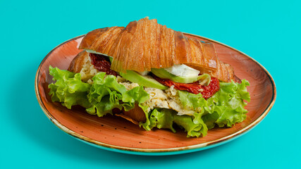 Croissant sandwich on plate