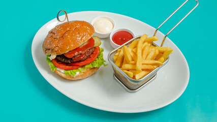 Burger and French fries  with ketchup and mayonnaise