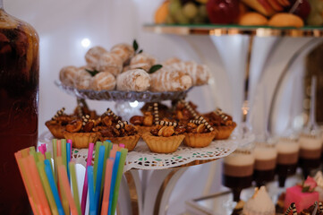 Elegant Dessert Table Featuring Assorted Pastries and Treats