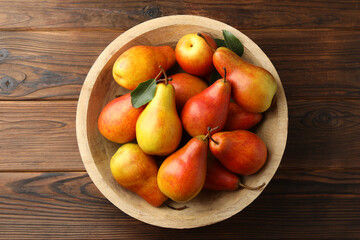 Ripe juicy pears on wooden table, top view