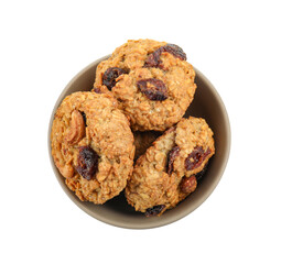 Delicious oatmeal cookies with dried cranberries and nuts in bowl isolated on white, top view