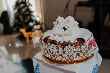 Elegant Traditional Cake Decorated with White Flowers and Festive Ambiance