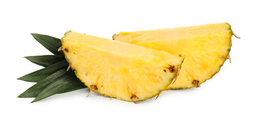 Slices of ripe pineapple and green leaves isolated on white