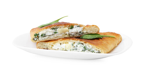 Pieces of tasty calzone with cheese and basil isolated on white