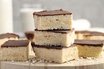 Delicious puffed rice bars on table, closeup