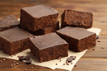Delicious chocolate puffed rice bars on wooden table, closeup