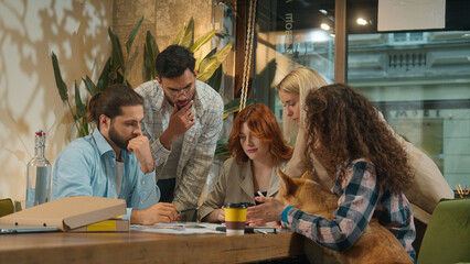 Multiethnic group creative pet dog friendly office coworking diverse team designers colleagues freelance coworkers business men women happy girls guys students friends talk study project drink coffee
