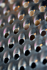 Close Up of a Steel Metal Perferated Hole Background Abstract Futeristic Circles