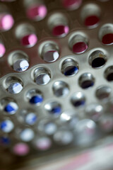 Close Up of a Steel Metal Perferated Hole Background Abstract Futeristic Circles