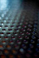 Close Up of a Steel Metal Perferated Hole Background Abstract Futeristic Circles