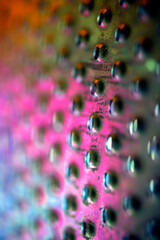 Close Up of a Steel Metal Perferated Hole Background Abstract Futeristic Circles