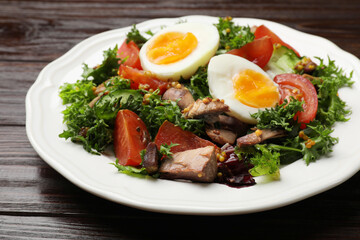 Delicious fresh tuna salad on wooden table, closeup