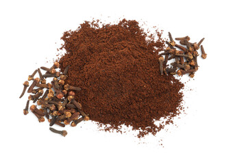 Pile of clove powder and dried buds on white background, top view. Aromatic spice