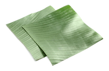 Naklejka premium Pieces of banana leaves isolated on white. Traditional meal serving