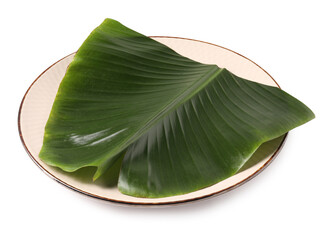 Plate with cut banana leaf isolated on white. Healthy eco serving