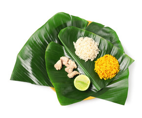 Cut banana leaves with different food isolated on white, top view. Healthy eco serving