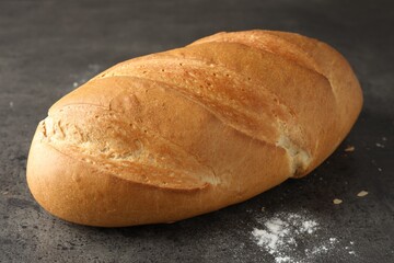 Freshly baked bread on grey table, closeup