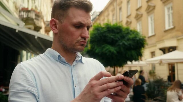 Male tourist guy Caucasian man businessman male traveler exploring city guide travel tourism search location using mobile phone gps online map geolocation outdoors find direction smartphone navigatior
