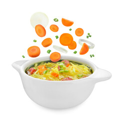 Vegetables falling into pot with soup on white background