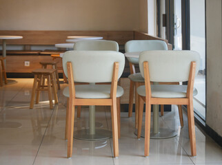 The cozy design of the cafe with table and chair on the morning. The modern casual the coffee shop