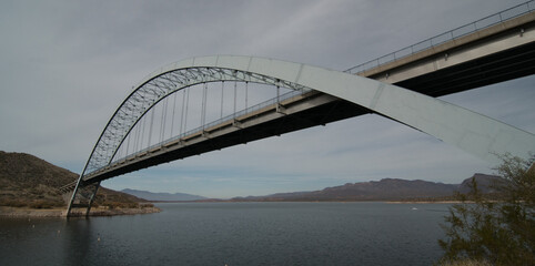 Arc of Theodore Roosevelt Lake Bridge on overcast day - 2