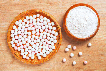 Balls of tasty tangyuan on wooden table   