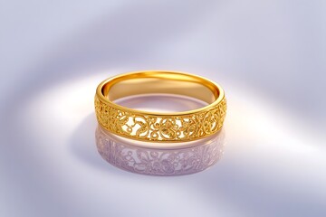 A gold ring with delicate filigree resting on a smooth white background, illuminated by sharp, vibrant reflections. contrast, white background, well-lit, sharp, 