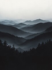 Fototapeta premium Tranquil misty mountain landscape with layers of forest and fog in grey and black tones