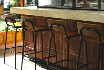 tables and row of chairs in a restaurant