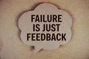 Failure Is Just Feedback text with speech bubble on paper craft background