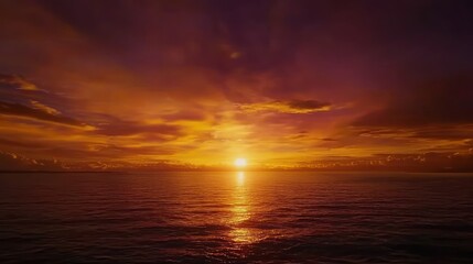 Vibrant sunset over calm ocean water.