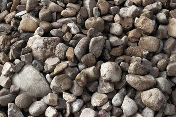 smooth pebbles background. variety of smooth, natural rocks with different shapes and textures