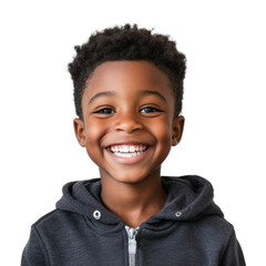 A young boy with a black hoodie and short hair is smiling