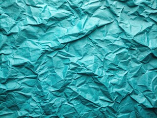 Obraz premium Crumpled turquoise slate paper: a vintage, abstract backdrop with ample copy space.