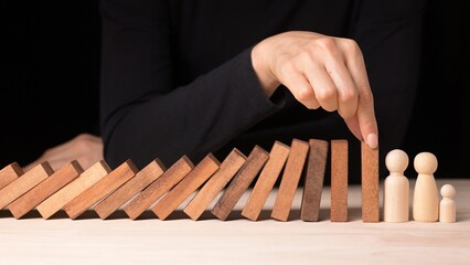 Hand Stopping Falling Dominos Risk Management in Business Crisis Decision Making Concept Office...