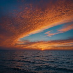 Obraz premium A stunning sky gradient transitioning from vibrant blue at the top to a warm, glowing orange near the horizon, capturing the beauty of a serene sunset. 