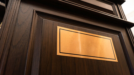 Golden name plate on wooden door to add text, names or logos