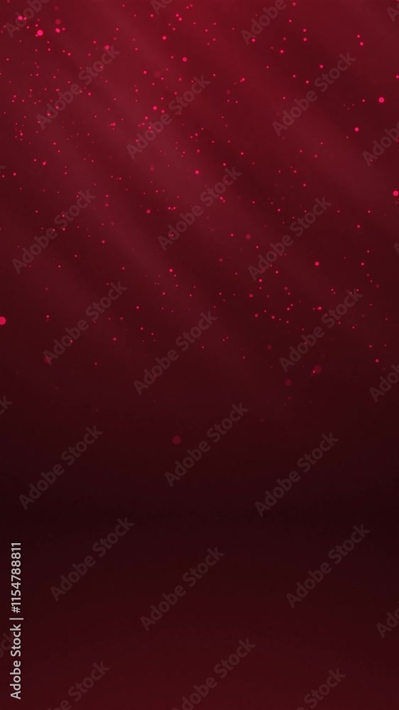 Poster red glowing circles particles falling in the air and light rays at the top left of a cyc wall backgr