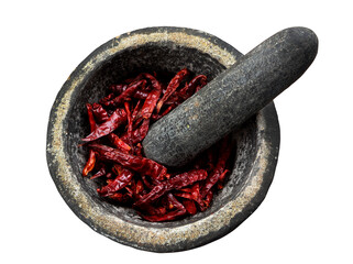 Dried red chilies in a stone mortar with pestle on transparent background