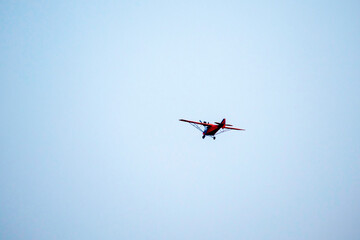 propeller plane is flying on isolated blue sky