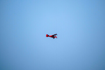 propeller plane is flying on isolated blue sky